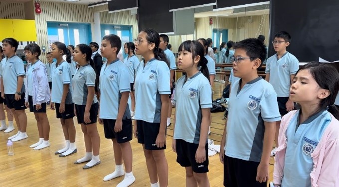 AGPS Choir having their weekly choir practice in the school’s Music Room.
